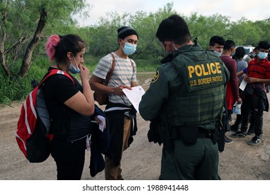 La Joya, TX, USA - May 26, 2021:  A Border Patrol Agent Processes An Unaccompanied Central American Male Minor Who Crossed The Rio Grande River Illegally To Request Asylum.