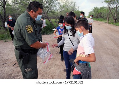 La Joya, TX, USA - May 26, 2021:  A Border Patrol Agent Processes  Unaccompanied Central American  Minors Who Crossed The Rio Grande River Illegally To Request Asylum.