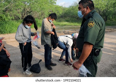 La Joya, TX, USA - May 26, 2021:  A Border Patrol Agent Processes  Unaccompanied Central American  Minors Who Crossed The Rio Grande River Illegally To Request Asylum.