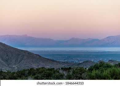 La Luz, New Mexico town view of Organ Mountains and White Sands Dunes National Monument at twilight sunset high angle above perspective with horizon