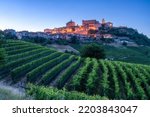 La Morra village illuminated in the evening. Langhe region of Piedmont, Cuneo, northern Italy.	