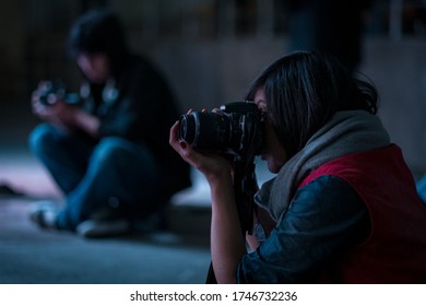 La Paz / Bolivia - July 26 2015: A Young Indigenous Female Photograph With Her Camera The Performs Breakdance Show