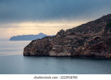 La Podadera Battery, Historical Landmark In Cartagena, Spain. Coast Of Mediterranean Sea. Cloudy Sunset Sky.