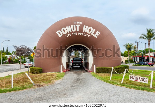 La Puente, CA, USA - March 31, 2013:
The Donut Hole is a bakery and landmark in La Puente, California,
USA. The building is shaped like two giant
donuts.