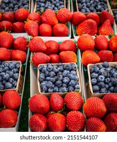 La Quinta CA USA - April 3 2022: Sunday Market Strawberries And Blue Berries For Sale In Boxes