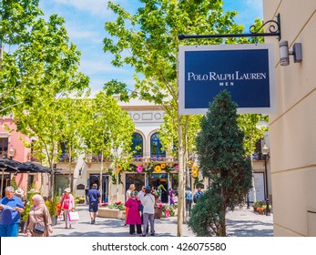 LA ROCA VILLAGE, GRANOLLERS, BARCELONA, CATALONIA, SPAIN - MAY 2016: Polo Ralph Lauren Men brand logo hang sign wall outside the official store on the street at the Roca Village street