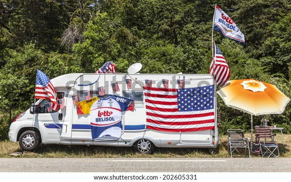 LA ROCHETTE, FRANCE- JUL 16:Image of a camping\
car of a fan of Le Tour de France, specific decorated,on a plain\
road in The Alps during the stage 16 of Le Tour de France on July\
16 2013 in La Rochette