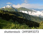 La Rosiere (Ski resort) overlooking the valley towards Bourg Saint Maurice, Northern French Alps, Savoie, France, with mountain peaks (Mont Pourri) and morning clouds