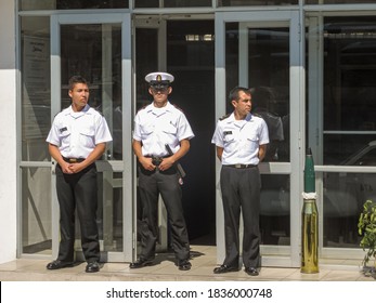 La Serena, Chile - December 7, 2008: 3 Stern Looking Guards In White Shirt And Black Pants In Front Of Entrance Of Naval Command Center Downtown.