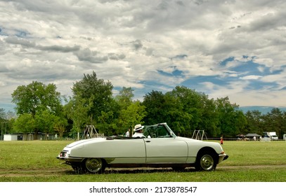 La Tour De Salvagny Rhone Alpes France
06 25 2022
Sixties Famous French Convertible Citroën DS With A Dramatic Sky In The Background. This Is An Electric  Retrofit Car.