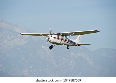 LA VERNE/CALIFORNIA - FEB. 11, 2018: Cessna 172 aircraft owned by Global Aviators Academy Inc. approaching the runway to make a landing at Brackett Air Field. La Verne, California USA
