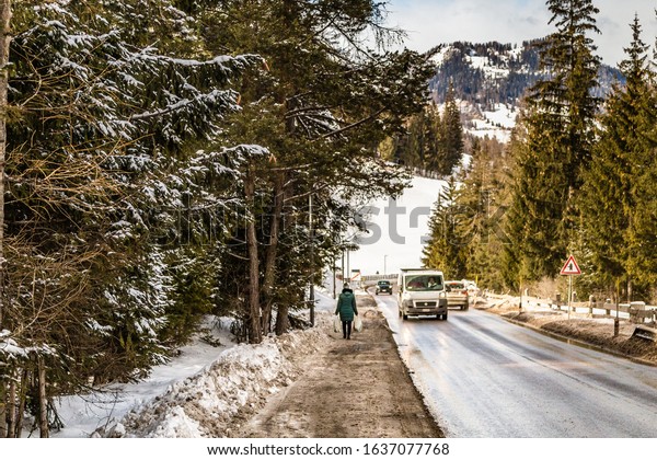 LA VILLA (BZ), FEBRUARY 11, 2019: cars
running in road while snow is covering
ground