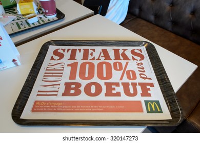 LA VILLE-AUX-DAMES, FRANCE - AUGUST 12, 2015: tray with McDonald's ad. McDonald's is the world's largest chain of hamburger fast food restaurants, founded in the United States.