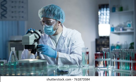 Lab assistant studying samples to detect pathologies, quality medical research