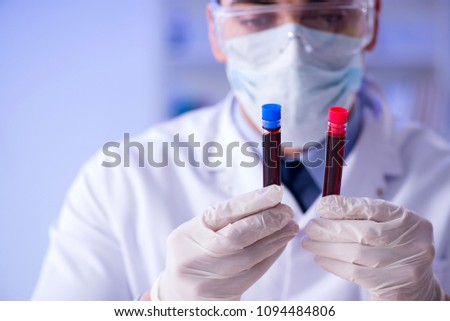 Lab assistant testing blood samples in hospital