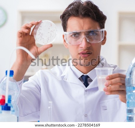 Lab assistant testing water quality