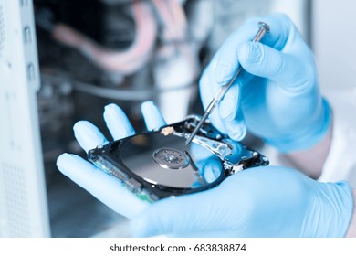 Lab Engineer Repairing And Fixing Broken Hard Disk For Data Recovery