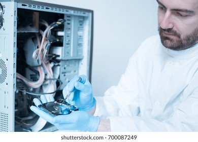 Lab Engineer Repairing And Fixing Broken Hard Disk For Data Recovery