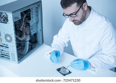 Lab Engineer Repairing And Fixing Broken Hard Disk For Data Recovery