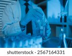 lab, team of medical research scientists work on a new generation disease cure, they use scientific equipment, test tubes, data implementing technology, laboratory looks busy,