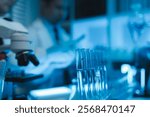 lab, team of medical research scientists work on a new generation disease cure, they use scientific equipment, test tubes, data implementing technology, laboratory looks busy,