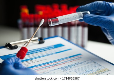 Lab Technician Holding Swab Collection Kit,Coronavirus COVID-19 Specimen Collecting Equipment,DNA Nasal And Oral Swabbing For PCR Polymerase Chain Reaction Laboratory Testing Procedure And Shipping 