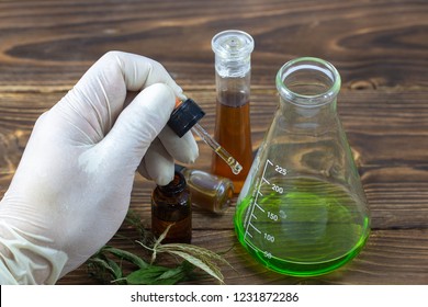 Lab test for cannabis oil extracts in jars for the medical therapy, selective focus