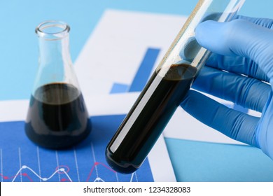 Lab Test Crude Oil In Vial In Scientist Hand. Natural Untreated Raw Oil.