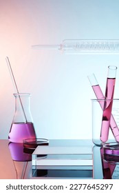 Lab theme with lab glassware filled colorful liquid and transparent empty podium on gradient background. Science laboratory research and development concept