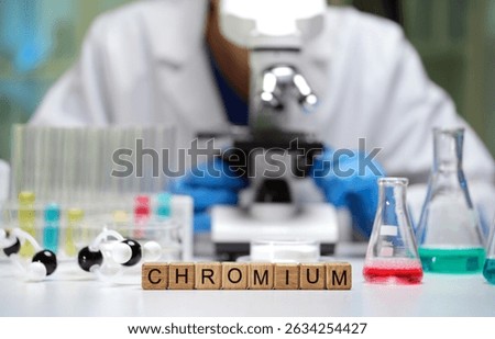 In the lab, we explore Chromium with a microscope and colorful beakers of various chemical solutions