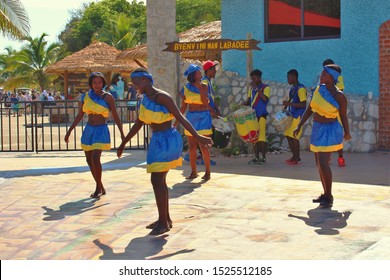 Labadee, Haiti - August 21st 2019: A group of traditional young dancers and drummers, performing outside the entrance to the private resort of Labadee, owned by Royal Caribbean cruise line.