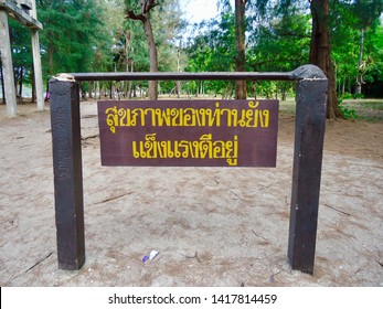 Label “Your Health Is Still Strong” In Thai Language Post On Khao Sam Roi Yod National Park, Thailand                