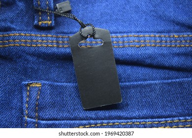 Label Price Tag Mockup On Blue Jeans.