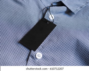 Label Price Tag Mockup On Blue Shirt.