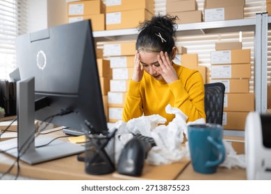 Label printer malfunction on work desk while stressed warehouse owner faces business problems and operational failure in storage office