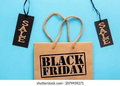 Label Sale Tag With Shopper Paper Bag, Black Friday Or Cyber Monday Shopper - Online Shopping Concept
