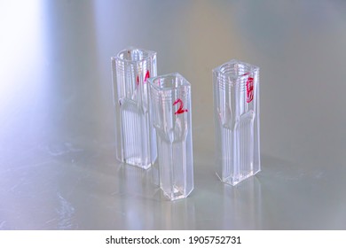 Labeled Empty Quartz Cuvette On The Lab Table Used For Spectrophotometry