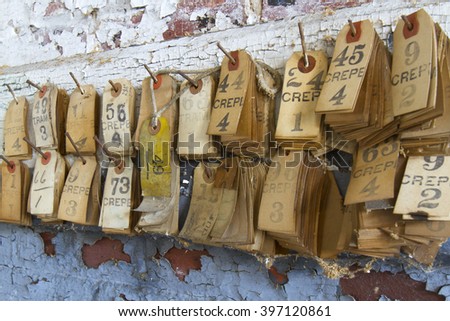 Labels for thread types on pegs in turn of the century silk throwing factory.