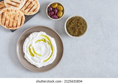 Labneh Yogurt, Cream  Cheese With Olive Oil And Zaatar . Traditional Middle Eastern Arabic Breakfast Dip.Top View With Copy Space