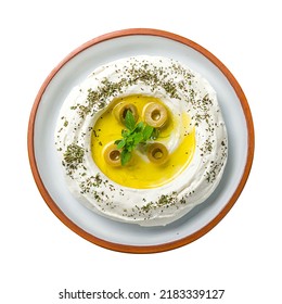 Labni with olives, arabic paste with olives top view on plate, isolated on white background