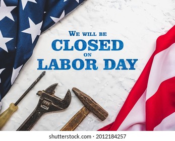LABOR DAY. Hand tools and the Flag of the United States of America lying on the table. View from above, close-up. Congratulations to family, relatives, friends and colleagues. National holiday concept - Shutterstock ID 2012184257