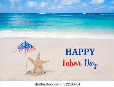 Labor Day USA background with starfishes and decorations on the sandy beach - Shutterstock ID 312100784