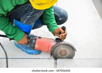 Labor using machine cutting joint concrete pavement