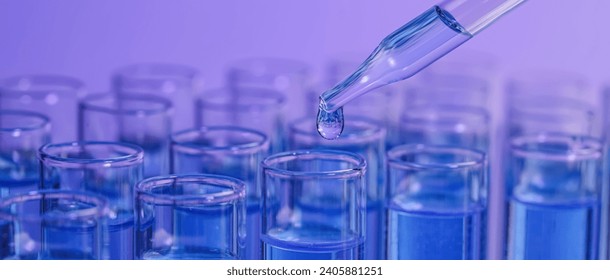 Laboratory analysis. Dripping reagent into test tube on violet background, closeup. Banner design - Powered by Shutterstock