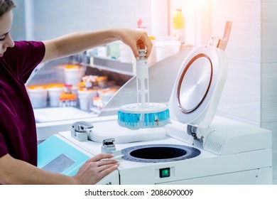 Laboratory assistant works with microwave hybrid tissue processor at the modern laboratory. - Shutterstock ID 2086090009