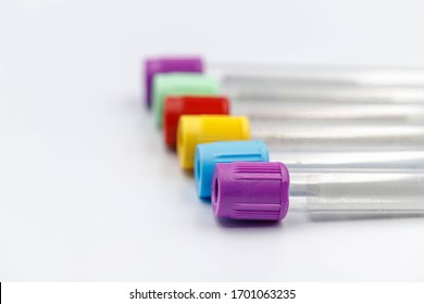 Laboratory concept, Selective focus of test tubes lay on white background, Multi colours of vacuum tube, Lab equipment, Health care check up.