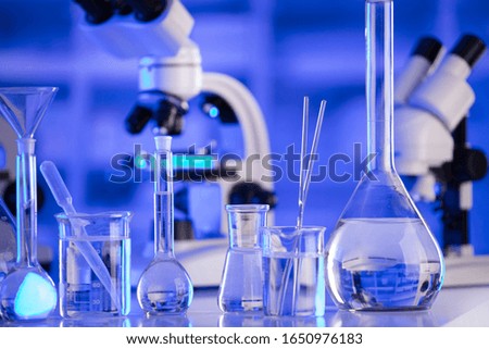 Laboratory glassware and microscope. Lab concept.