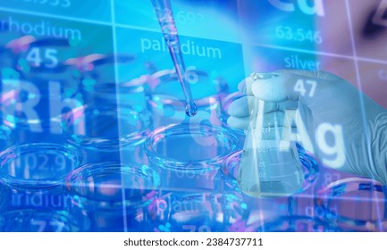 Laboratory glassware, test tubes and flasks in laboratory with chemical equations and periodic chart
