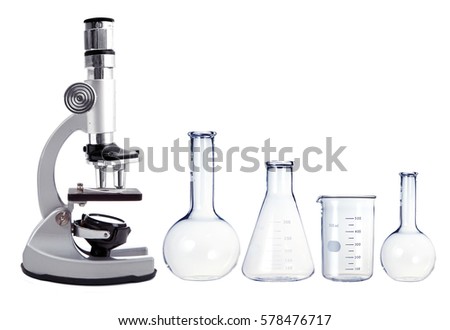 Laboratory metal microscope and empty test tubes isolated on white