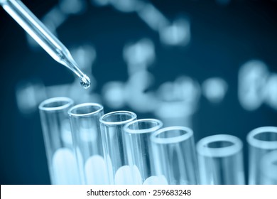 Laboratory research, dropping liquid to test tubes, Blue tone  - Shutterstock ID 259683248